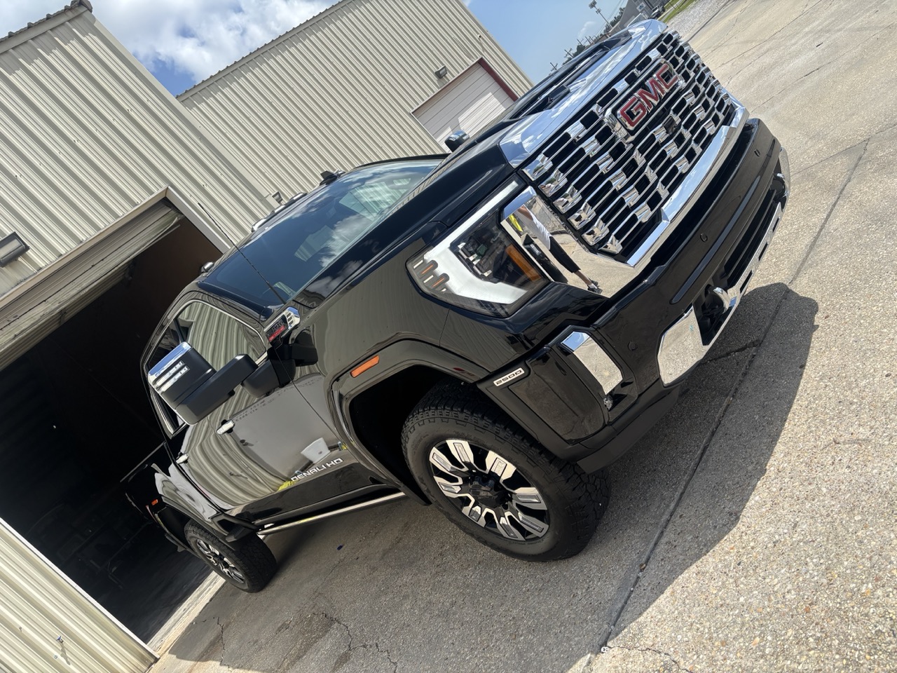 A freshly detailed black pickup truck, showroom finish