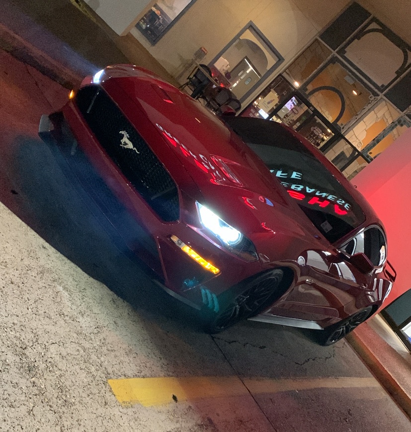 Glossy red performance car after paint correction