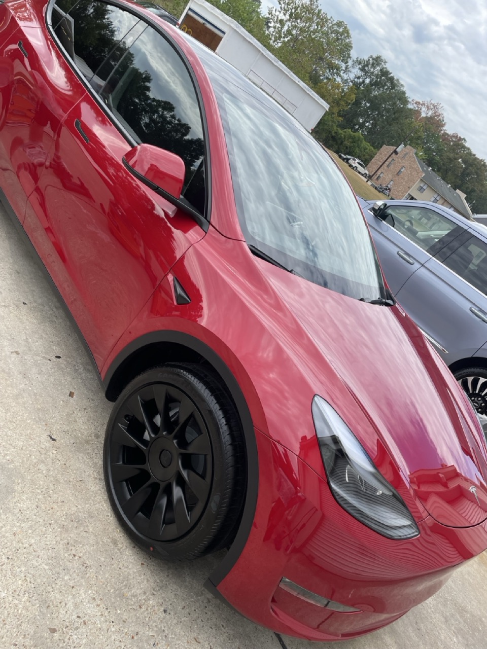 Red Tesla with a ceramic-coated finish